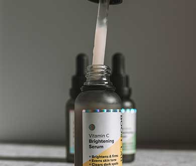 vitamin c serum bottles and a dropper